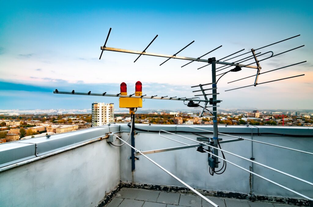 TV antenna on the roof of a multi-story building